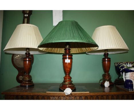 Three brown marbled Lamp bases with cream and green shades.