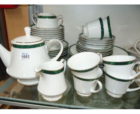 A Noritake ''Legendary'' Dinner/tea service, white ground with green rim including six large dinner plates, eight side plates