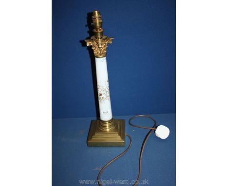 A brass lamp Base with white glass stem.