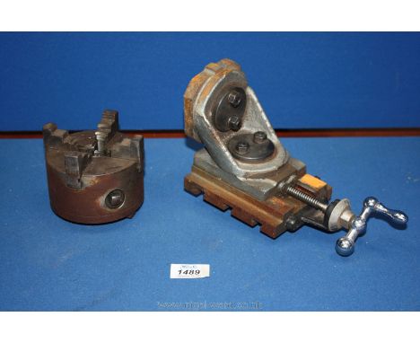 A quantity of Lathe parts incluidng tool holder and four jaw chuck
