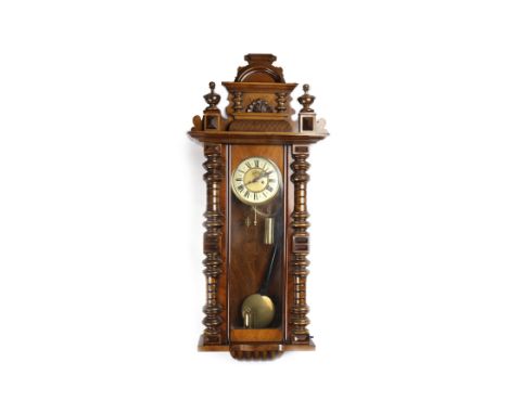 VICTORIAN WALNUT WALL CLOCKwith enamelled Roman numeral chapter ring, subsidiary seconds dial, two front winding key holes, b
