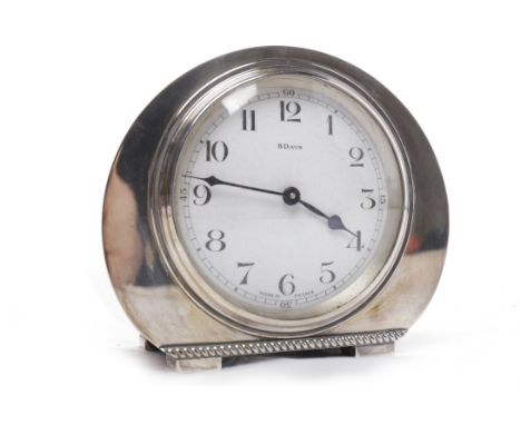 ART DECO 8 DAY FRENCH MANTEL CLOCKthe enamel dial with Arabic numerals and blued steel hands, contained within a circular whi