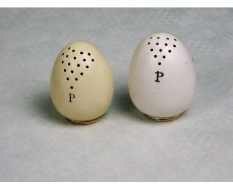 Two James MacIntyre late 19th century ceramic pepper pots formed as hen's eggs, (each 6.5cm).