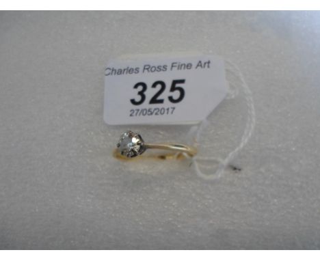 A single stone diamond ring, the brilliant cut diamond to a raised claw mount and tapered shoulders.