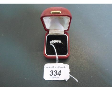 A five stone diamond half-hoop ring, the graduated mixed old and brilliant cut diamonds, claw mounted to plain shank.