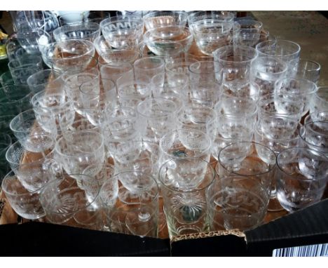 A large quantity of Edwardian and later glassware, to include: wine glasses, champagne bowls, a decanter and others.