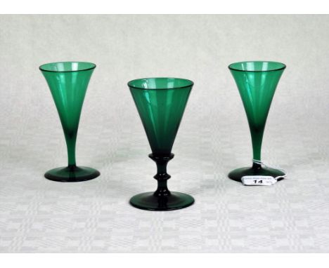 A Bristol green wine glass of conical form on stepped column, (13cm), together with two further Bristol green wine glasses.