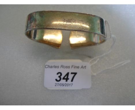 A Georg Jensen sterling silver napkin ring, (5.5cm wide).