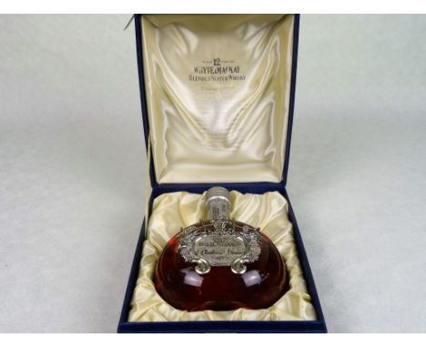 A bottle of Whyte & MacKay De Luxe 12 Year Old Blended Scotch Whisky, in a Royal Wedding decanter, marking the wedding of the