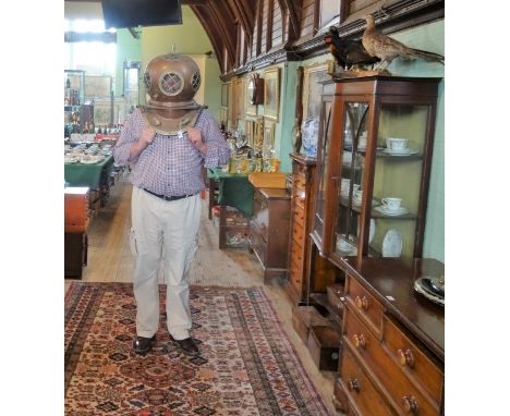 A large copper and brass deep sea diver's helmet, (46cm tall).