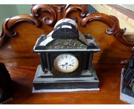 A Victorian slate mantle clock, the enamel dial bearing Roman numerals, (37cm x 38cm).