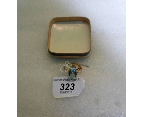 A single stone aquamarine ring, the claw mounted inverted pear shaped aquamarine in raised setting above three stone diamond 