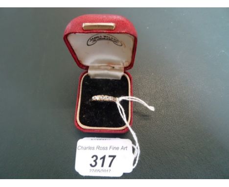 A five stone diamond half-hoop ring, the graduated mixed old cut diamonds in carved claw mount.