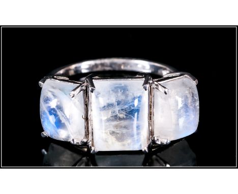 Rainbow Moonstone Trilogy Ring, the centre baguette cut cabochon of 4cts flanked by two further, similar rainbow moonstones t