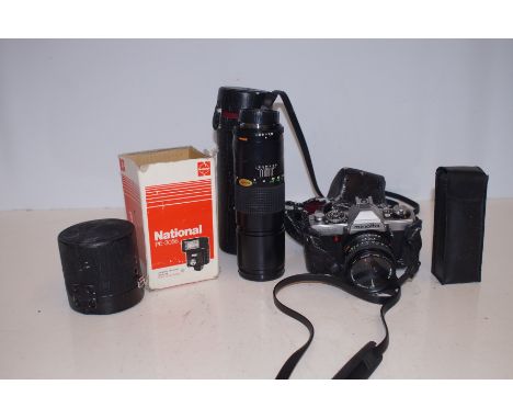 Minolta camera with additional lenses to include good quality tripod 