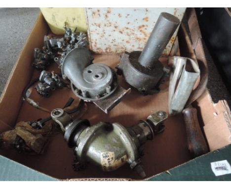 A box containing and assortment box sockets, new old stock Mikuni parts, an angled universal joint and vintage car horn