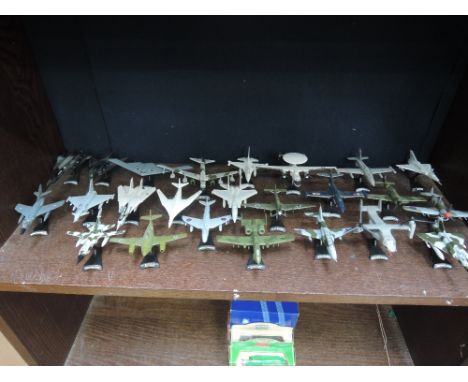 A shelf of twenty four modern die-cast aircrafts including, Bell Boe Osprey, B-52, Hawker Typhoon etc