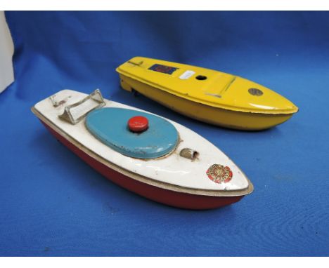 Two early 20th century Sutcliffe tinplate and clockwork model Comet and similar speed boats