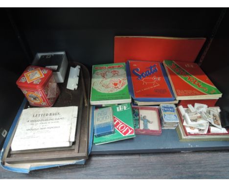 A shelf of vintage games and toys including UPL party games, Bagatelle etc