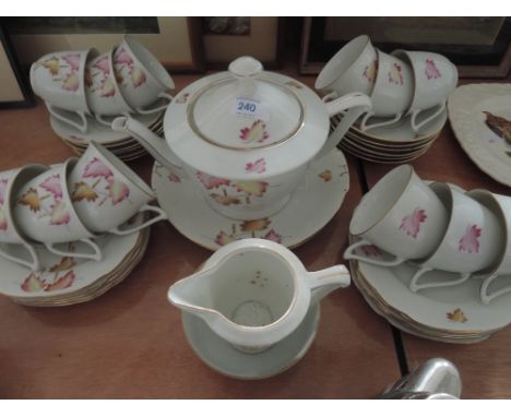 A part tea service with autumnal leaves design