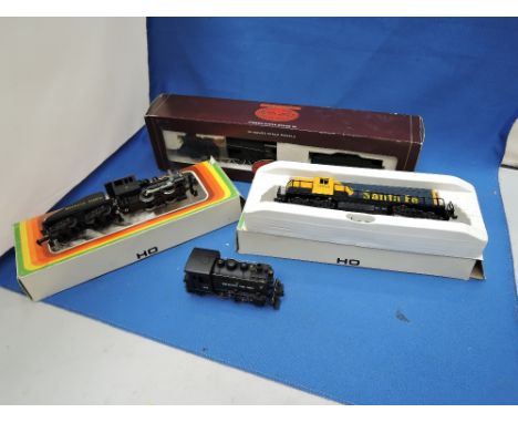 A Hornby OO gauge 2-8-0 loco and tender, boxed R2053, a Rivarossi HO scale 0-4-0 tank engine and two Mehano Tehnika Izola HO 