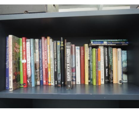 A shelf of coffee table railway related volumes