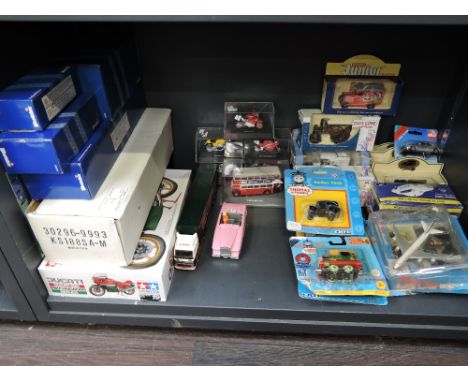 A shelf of mixed die-casts including ERTL Thomas The Tank Engine, Weetabix Advertising and Eddie Stobart etc