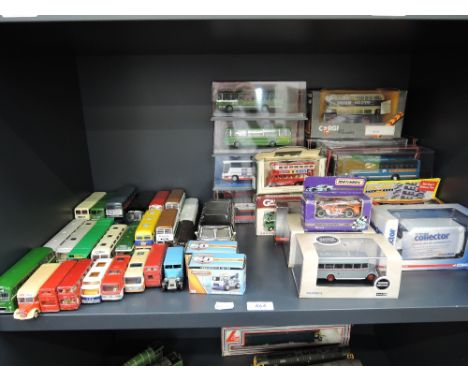 A shelf of mixed die-cast including Matchbox, Corgi, EFSI, mainly buses and half with boxes