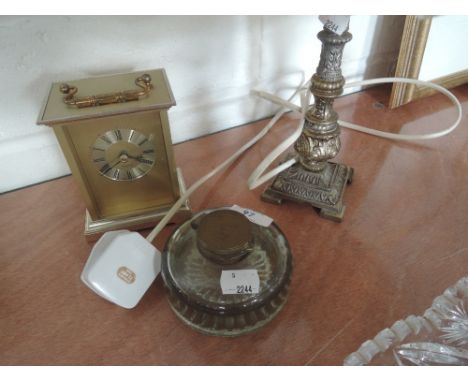 A glass lidded inkwell, carriage clock and lamp