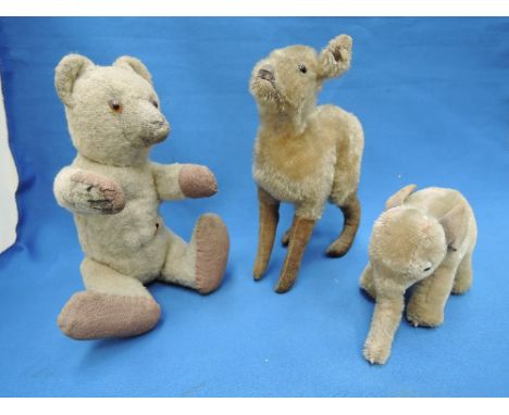 A mid 20th century Steiff Doe, similar Elephant and a mid 20th century straw filled, fawn plush Teddy Bear having plastic eye