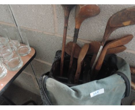 A golf bag and vintage golf clubs