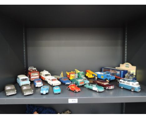 A shelf of Dinky, Corgi and similar die-casts including Commer bus with film crew, Dinky police accident unit van, Dinky Kenw