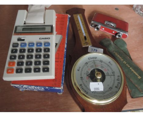 A set of pocket binoculars, barometer, Casio mini printing calculater, map reading tools etc