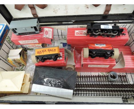 A selection of Hornby Dublo OO gauge including 0-6-0 tank engine, Suburban Coach boxed 4025, Brake Van boxed 4310, Saxa Salt 