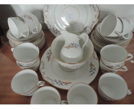 A part tea service white and gilt with stylised floral design, approx 37 pieces