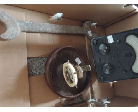 A box containing ships wheel brass on treen nut cracker, an Avometer etc