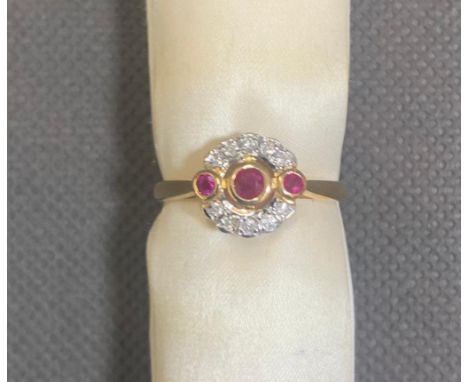 14 carat gold ring set with ruby and 10 small diamonds, 3.28 grams size Q.5, never worn