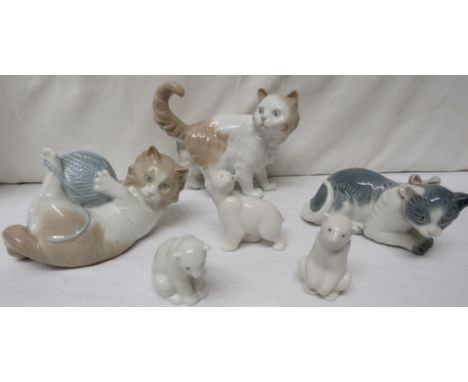 Nao animal figures - three small polar bears, standing cat, cat with wool (1978), and cat with bow (1985)