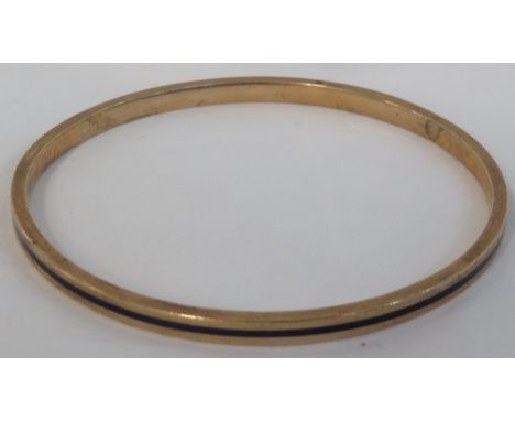 Yellow metal bangle inlaid with a line of black enamel, stamped 9CT D&amp;F, scratch marks 'as a gift....1923', diameter 7.5c