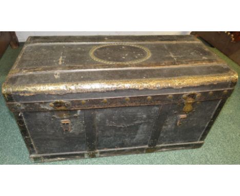 19th century black composition trunk with brass banding, studwork and leather handles, the interior lined with striped fabric