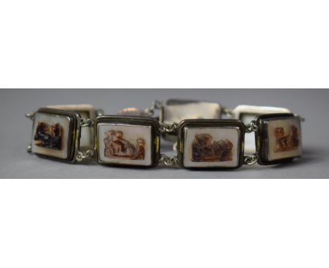 A Vintage Italian Seven Panel Sectional Bracelet (Stamped 900) Having Mother of Pearl Panels Decorated in Relief with Gladiat