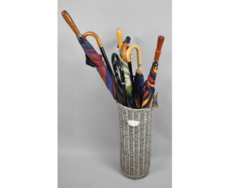 A Cylindrical Stick Stand with Label Inscribed "Shabby Chic" Containing Various Walking Sticks and Umbrellas 