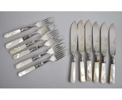 A Set of Six Mother of Pearl Handed and Silver Banded Fish Knives and Forks 