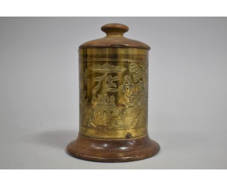 A Mid 20th Century Brass and Wooden Circular Tea Caddy with Engraved Decoration, 14cm high 