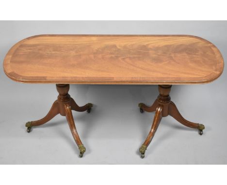 A Modern Twin Pedestal Crossbanded Oval Walnut Coffee Table, 65cm Long 