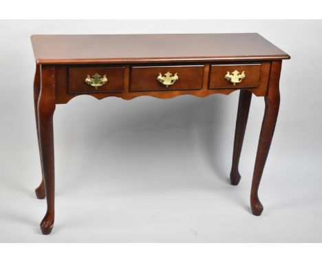A Reproduction Mahogany Three Drawer Narrow Side Table on Extended Cabriole Supports, 92cm wide 