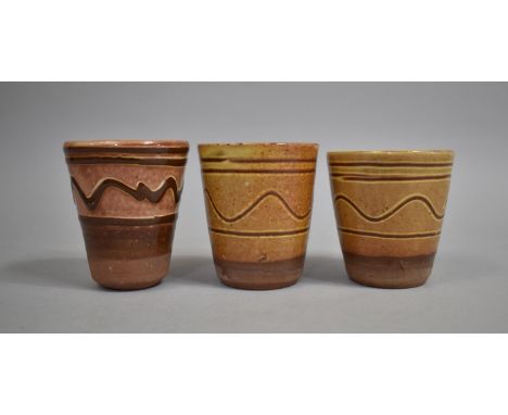A Collection of Three Treacle Glazed Terracotta Beakers by Winchcombe Pottery, Each 9cm high 