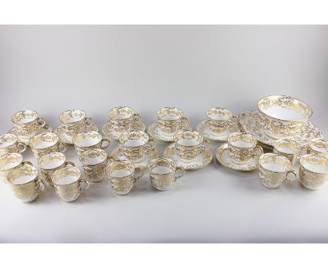 A Victorian porcelain part tea/coffee set, with scrolling gilt decoration on white ground, comprising two serving platters, s