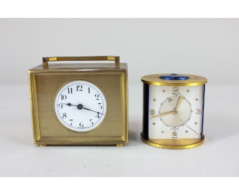 A Jaeger gilt metal alarm clock, cylindrical shape with blue panels and button (glass face damaged), 5cm high, and a French r