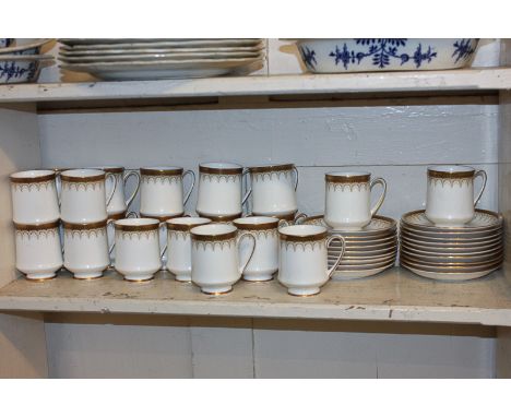 A Paragon porcelain Athena pattern part coffee service comprising twenty-one cups and nineteen saucers, together with a Duche